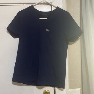 Navy blue figs scrubs. Top/Bottom size is a small.